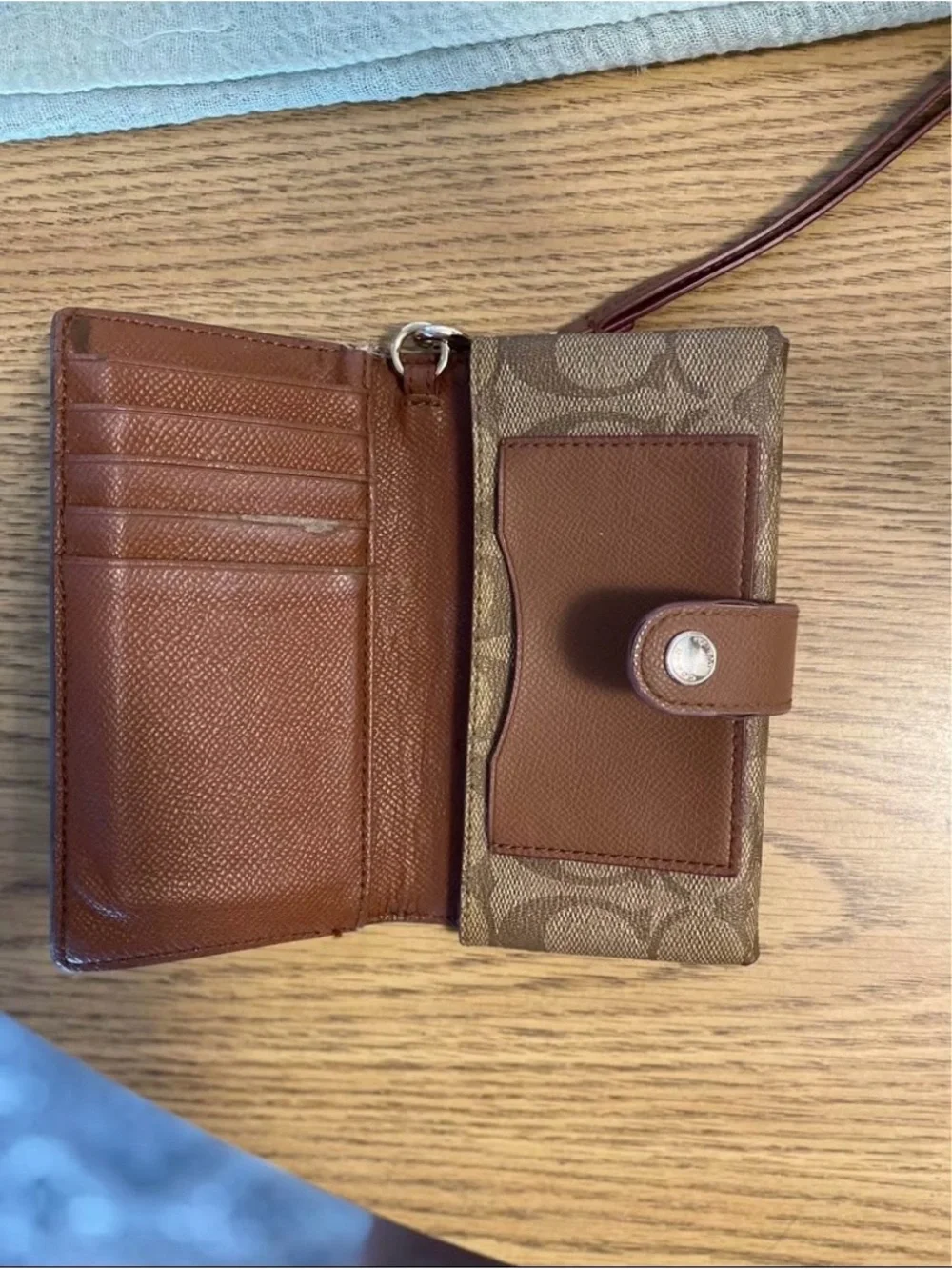 Coach Brown Signature Canvas Phone Wristlet with Snap Closure
